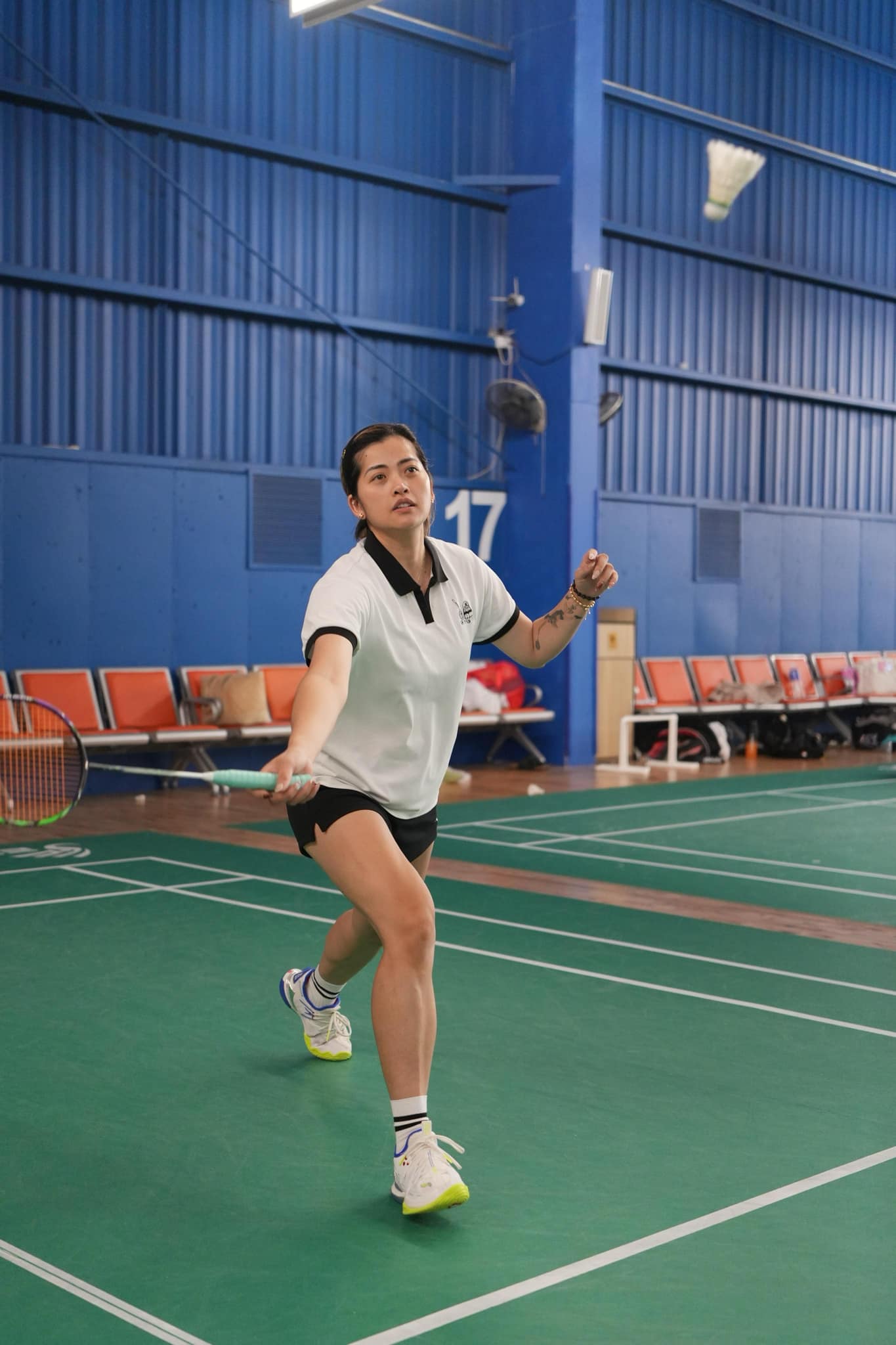 Coach Nhi Phung playing badminton